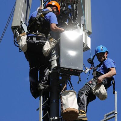Technicians are roped up as they install 5G antennas of Swiss telecom operator Swisscom on a mast in the mountain resort of Lenzerheide, Switzerland June 13, 2019. REUTERS/Arnd Wiegmann - RC1B7B856730